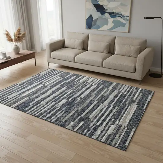 Gray Charcoal And Ivory Abstract Washable Area Rug With UV Protection Photo 1