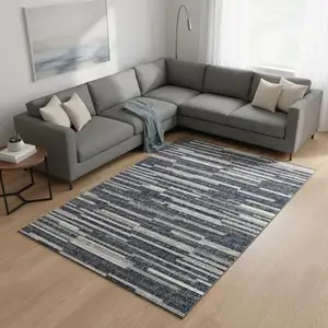Photo of Gray Charcoal And Ivory Abstract Washable Area Rug With UV Protection