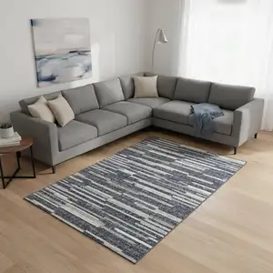 Photo of Gray Charcoal And Ivory Abstract Washable Area Rug With UV Protection