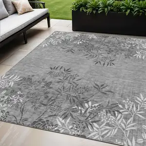 Photo of Gray Charcoal And Ivory Floral Washable Indoor Outdoor Area Rug