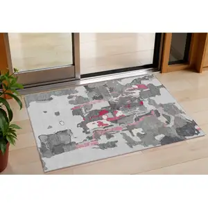 Photo of Gray Charcoal And Pink Abstract Washable Indoor Outdoor Area Rug