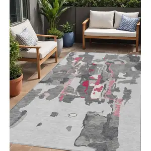 Photo of Gray Charcoal And Pink Abstract Washable Indoor Outdoor Area Rug
