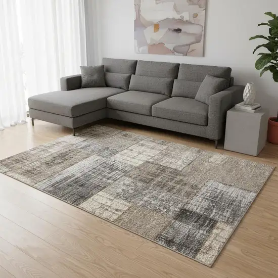Gray Cream And Tan Abstract Area Rug Photo 1
