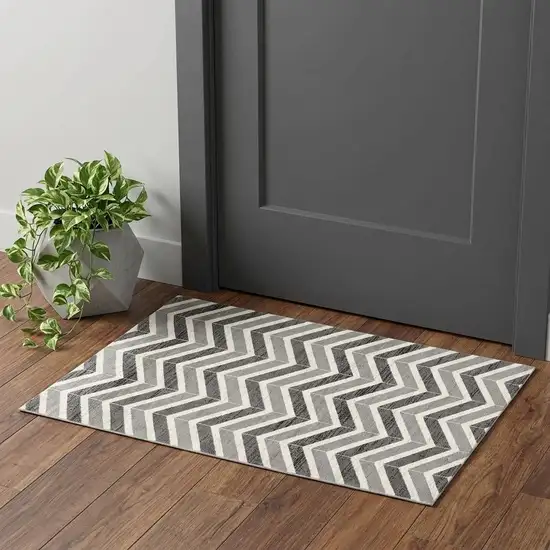 Gray And Ivory Chevron Distressed Area Rug Photo 1