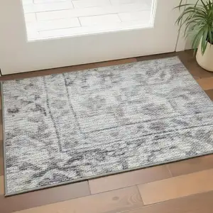 Photo of Gray Floral Power Loom Worn Faded Area Rug