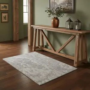 Photo of Gray Floral Power Loom Worn Faded Area Rug