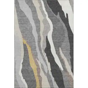 Photo of Gray Gold And Charcoal Abstract Washable Area Rug With UV Protection