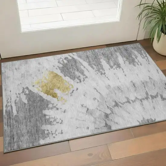 Gray Gold And Ivory Abstract Washable Area Rug With UV Protection Photo 1