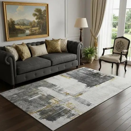 Gray Gold And Ivory Abstract Washable Area Rug With UV Protection Photo 1