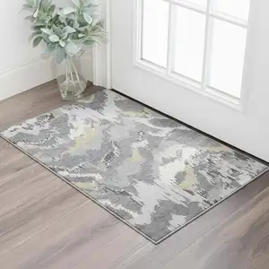 Photo of Gray Gold And Ivory Abstract Washable Area Rug With UV Protection