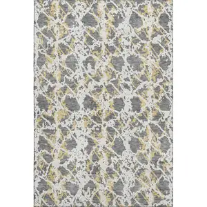 Photo of Gray Gold And Ivory Abstract Washable Area Rug With UV Protection