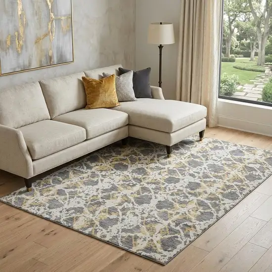 Gray Gold And Ivory Abstract Washable Area Rug With UV Protection Photo 1