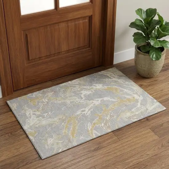 Gray Gold And Ivory Abstract Washable Area Rug With UV Protection Photo 1
