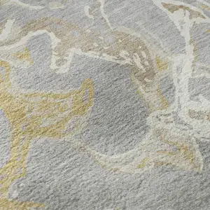Photo of Gray Gold And Ivory Abstract Washable Area Rug With UV Protection