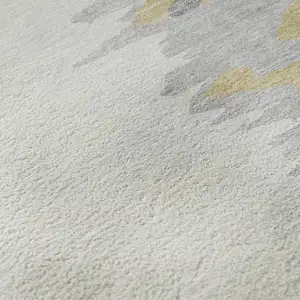 Photo of Gray Gold And Ivory Abstract Washable Area Rug With UV Protection