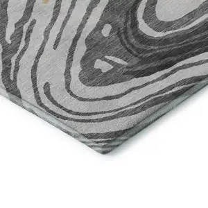 Photo of Gray Gold And Ivory Abstract Washable Area Rug With UV Protection