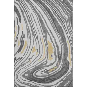 Photo of Gray Gold And Ivory Abstract Washable Area Rug With UV Protection