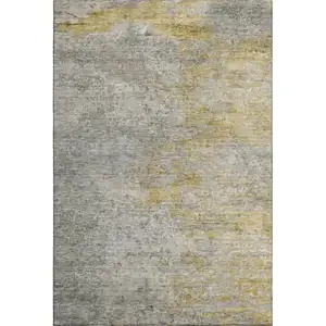 Photo of Gray Gold And Ivory Abstract Washable Area Rug With UV Protection