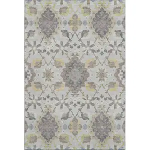 Photo of Gray Gold And Ivory Oriental Washable Area Rug With UV Protection