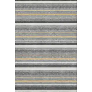 Photo of Gray Gold And Ivory Striped Washable Area Rug With UV Protection