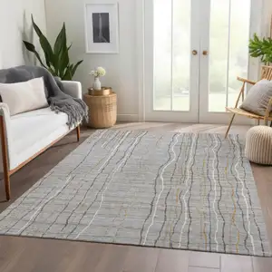 Photo of Gray Gold And Ivory Striped Washable Area Rug With UV Protection