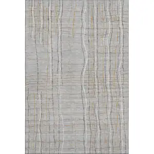 Photo of Gray Gold And Ivory Striped Washable Area Rug With UV Protection