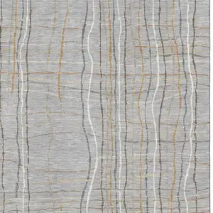 Photo of Gray Gold And Ivory Striped Washable Area Rug With UV Protection