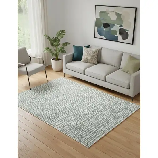 Gray Green And Ivory Striped Distressed Stain Resistant Area Rug Photo 1
