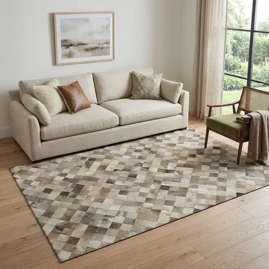 Beige Gray And Ivory Cowhide Print Washable Area Rug With UV Protection Photo 1