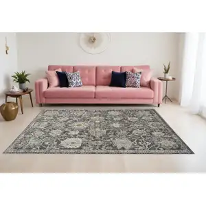 Photo of Gray Ivory And Black Floral Distressed Area Rug