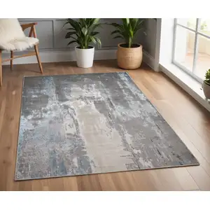 Photo of Gray Ivory And Blue Abstract Area Rug