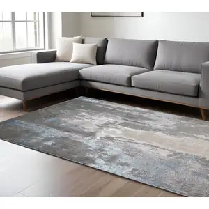 Photo of Gray Ivory And Blue Abstract Stain Resistant Area Rug