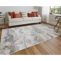 Photo of Gray Ivory And Gold Abstract Stain Resistant Area Rug