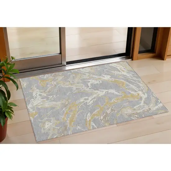 Gray Ivory And Gold Abstract Washable Indoor Outdoor Area Rug Photo 1