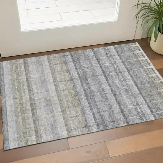 Gray Ivory And Gold Striped Washable Area Rug With UV Protection Photo 1