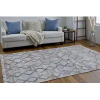 Photo of Gray Ivory And Tan Geometric Hand Woven Stain Resistant Area Rug With Fringe