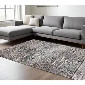Photo of Gray Ivory And Taupe Abstract Stain Resistant Area Rug