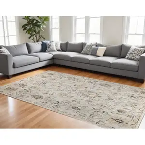 Photo of Gray Ivory And Yellow Floral Distressed Area Rug