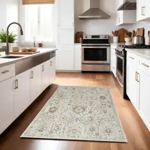 Photo of Gray Ivory And Yellow Floral Distressed Area Rug