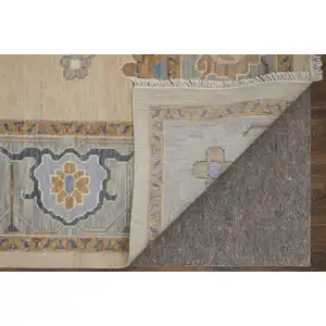 Photo of Gray Ivory and Blue Wool Floral Hand Knotted Area Rug With Fringe