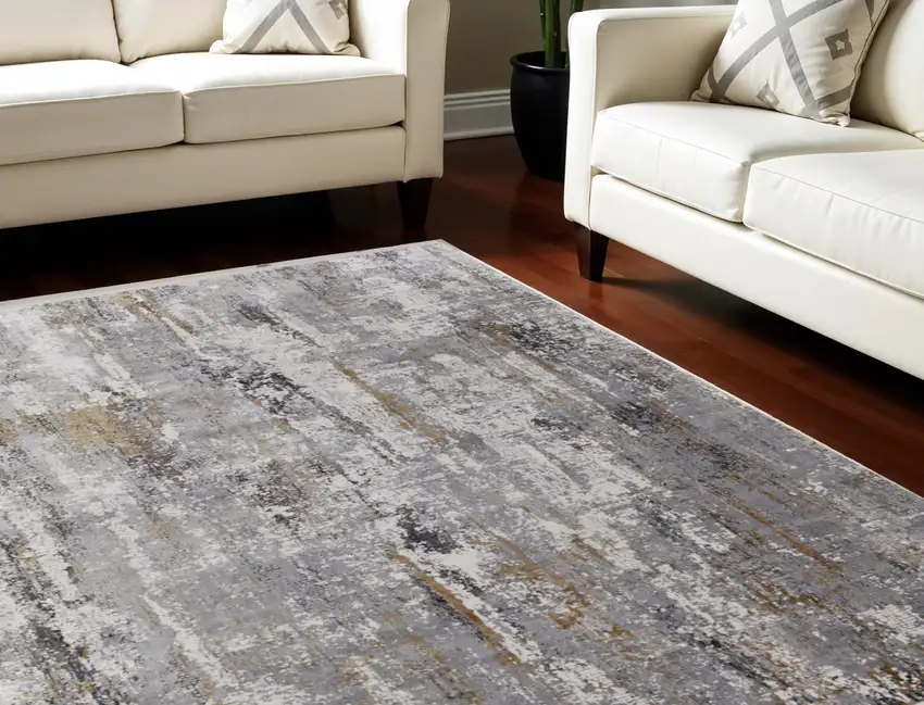 Gray Ivory and Gold Abstract Power Loom Area Rug With Fringe Photo 1
