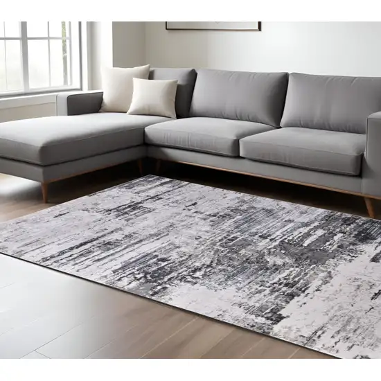 Gray Ivory and Taupe Abstract Power Loom Worn Faded Area Rug Photo 1