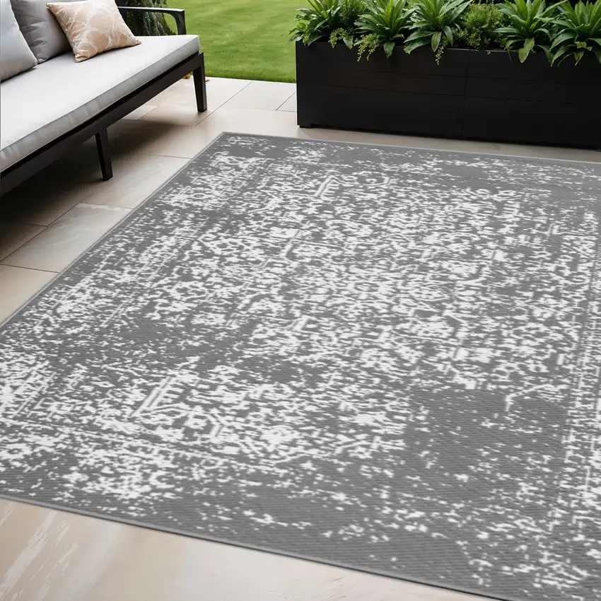 Gray Machine Braided Distressed Area Rug With UV Protection Photo 1