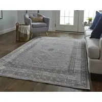 Photo of Gray Orange And Ivory Floral Power Loom Stain Resistant Area Rug