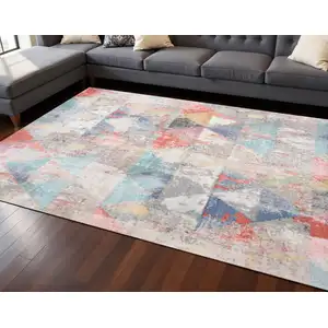 Photo of Gray Pink And Blue Geometric Area Rug