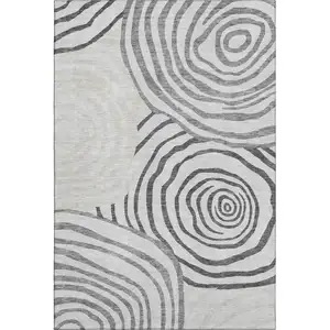 Photo of Gray Silver And Beige Abstract Washable Area Rug With UV Protection