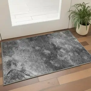 Photo of Gray Silver And Black Abstract Washable Area Rug With UV Protection