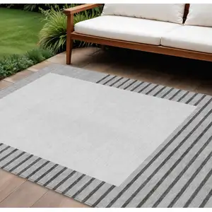 Photo of Gray Silver And Black Striped Washable Indoor Outdoor Area Rug