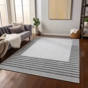 Photo of Gray Silver And Black Striped Washable Indoor Outdoor Area Rug