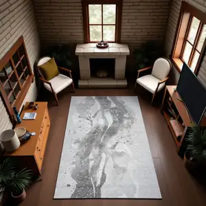 Photo of Gray Silver And Charcoal Abstract Washable Area Rug With UV Protection